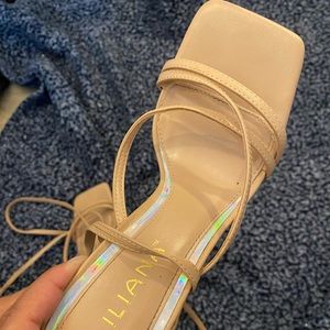 Nude lace up heels.